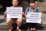 Rights activists, Nguyen Thuy Hanh (right), and Truong Van Dung, protest the mistreatment of political and other prisoners in Vietnam’s capital, Hanoi, on 29 June 2019. Photo: UCAN/courtesy of Nguyen Thuy Hanh