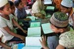 Rohingya children study the Qu’ran in a makeshift Islamic school at Balukhali refugee camp in Cox’s Bazar. Photo: UCAN/Stephan Uttom