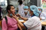A doctor examines a blind patient in Ho Chi Minh City on November 15. Photo: UCAN