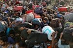 A dangerous crush of migrant workers at a bus station in Ghaziabad, India, as they try to return to their villages in March to limit the spread of Covid-19. The country’s authorities completely ignored the plight of millions of migrant workers when it imposed the during a 21-day nationwide lockdown with only four hours’ notice. Photo: CNS/Reuters