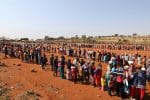 People in Laudium, South Africa, stand in line to receive food aid May 2020, amid the Covid-19 pandemic. Photo: CNS/ Reuters