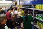 Poor people ‘buy’ goods at the shop in Cai Tac Parish of Hau Giang province on January 3. Photo: UCAN/courtesy of gpcantho.com