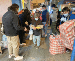 OMI Youth distributing food food to the needy.