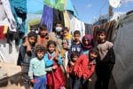 A family of Syrian refugees informal tent settlement in the Bekaa Valley, Lebanon, on March 12. Photo: CNS/Reuters
