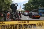 Armed police officers stand guard along a closed road following a suicide bomb attack during Palm Sunday Mass at the Sacred Heart of Jesus Cathedral in Makassar, Indonesia, on March 28. Photo: CNS/Antara Foto via Reuters