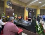 With Covid-19 restrictions in place, Catholics gather in small groups around the tomb of St. Oscar Romero at Metropolitan Cathedral of the Holy Saviour in San Salvador on March 24. Photo: CNS