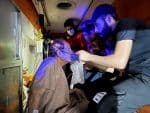 A Covid-19 patient is prepared for evacuation in an ambulance outside the Ibn Khatib hospital in Baghdad on April 25, after a fire caused by an oxygen tank explosion. Photo: CNS/Reuters