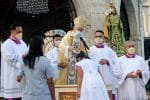 Archbishop Brown baptises a young girl during Mass in Cebu on April 14. Photo: UCAN/Catholic Bishops’ Conference of the Philippines