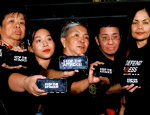 Journalists, including Maria Ressa (second from right), raise their smart phones with words “Stop the Attacks!” in a rally for press freedom in Quezon City, Philippines, on 15 February 2019. Photo: CNS/Reuters