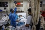 A resident doctor treating a Covid-19 patient inside the emergency room of the Holy Family Hospital in New Delhi on May 1. Photo: CNS/Reuters