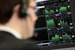A broker monitors financial information on the IG Index trading floor in London the United Kingdom. File photo: CNS/Reuters
