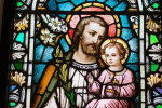 Stained glass window depticting St. Joseph with the Child Jesus. Photo: Josh Applegate on Unsplash