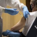 Receiving the first dose of the Covid-19 vaccine in the atrium of the Paul VI hall at the Vatican. File photo: CNS/Vatican Media