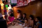 A family shares a plate of rice in their shanty home in Manila, the Philippines, May 2020. Photo: CNS/Eloisa Lopez, Reuters