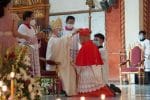 Cardinal Advincula, right, receiving his red hat from Archbishop Brown, left, on June 18. Photo UCAN/courtesy of CASAC