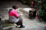 A meal delivery worker resting. Photo: Catholic Commission of Labour Affairs