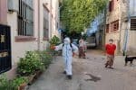 Volunteers from the Mandalay Catholic Youth Commission spray disinfectant around houses. Photo: UCAN/MCYC