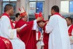 Bishop Ma places a bishop’s mitre on the head of Bishop Li during an ordination ceremony on July 28. Photo: UCAN/www.chinacatholic.cn