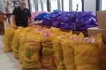 Father Ocon with some of the donations received by the Jesuits at the Philippine General Hospital in Manila. Photo UCAN/courtesy of Father Ocon
