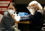 A woman receiving a dose of the Pfizer Covid-19 vaccine during a mass vaccination programme at a shopping mall in Jakarta, Indonesia, on August 31. Photo: CNS/Ajeng Dinar Ulfiana, Reuters