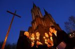 People light candles in front of a Catholic church during the Easter Vigil in the Siberian city of Krasnoyarsk, Russia, in 2015. File photo: CNS/Ilya Naymushin, Reuters