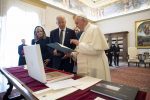 Joe Biden, accompanied by his wife, Jill, exchanges gifts with Pope Francis during a meeting at the Vatican on October 29. Photo: CNS/Vatican Media