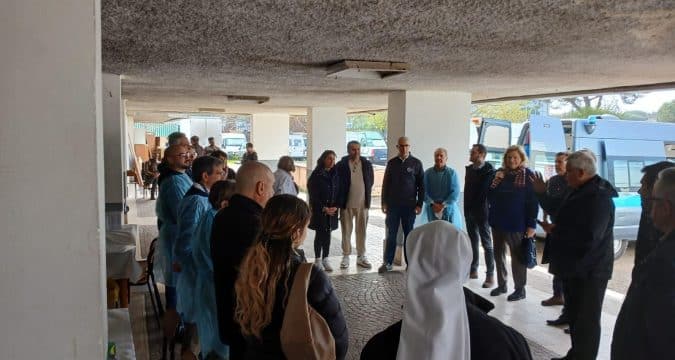 As Pope Francis leaves hospital, his almoner and doctors bring medical care to migrants