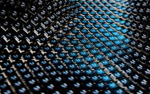 Dense grid of small blue and black tiles, each with a white AI-like logo, forming a diagonal pattern.