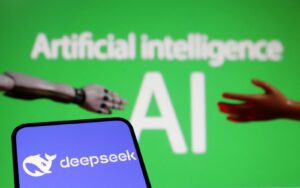 Robot hand and human hand reaching toward a blue screen with the 'deepseek' logo against a green AI-themed background.